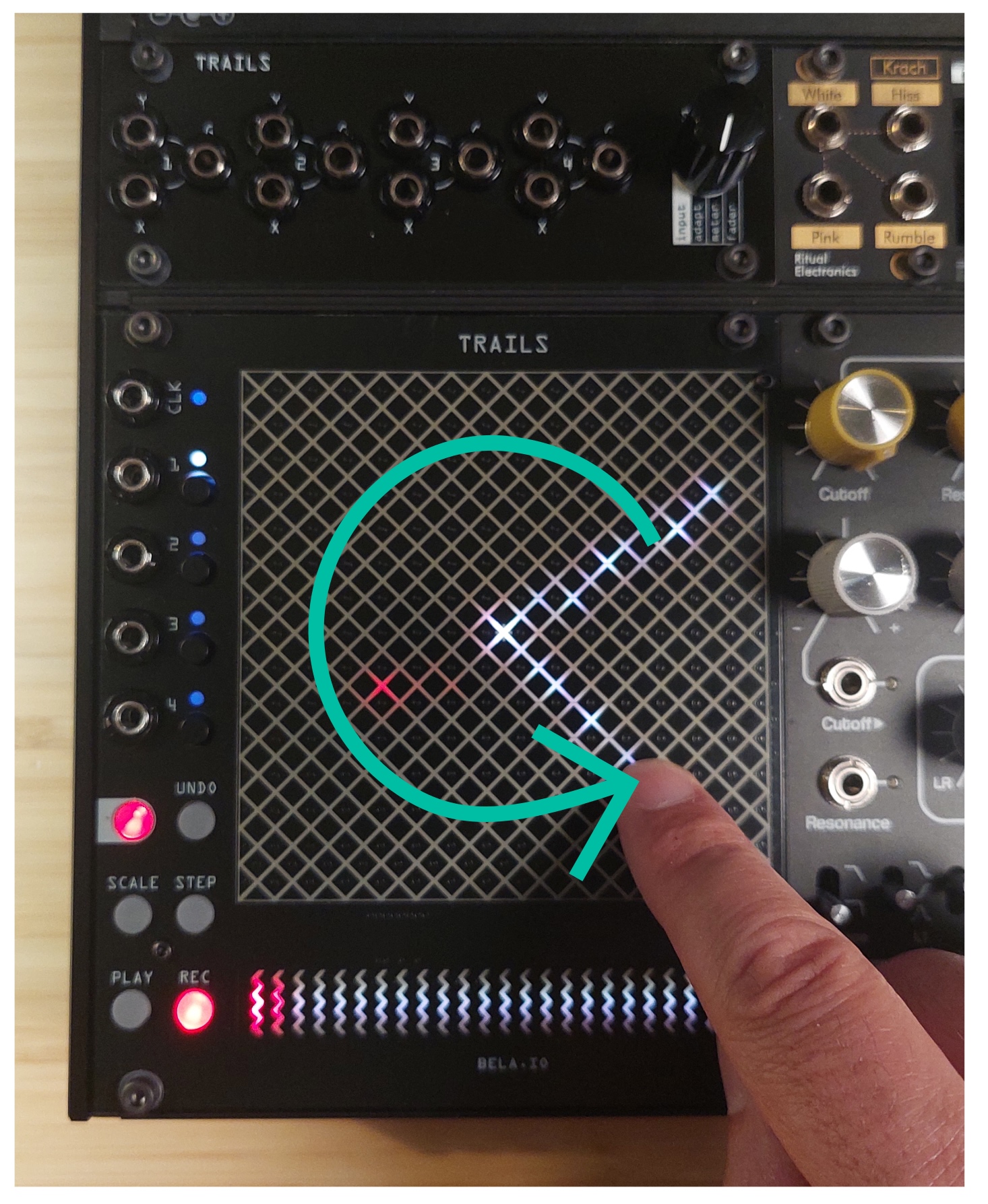 Hand performing a rotation gesture on the touchpad